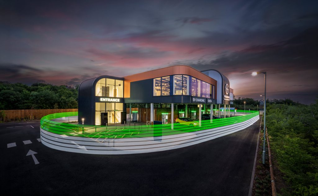 GRIDSERVE Markham Vale Electric Forecourt at night with a bit of neon